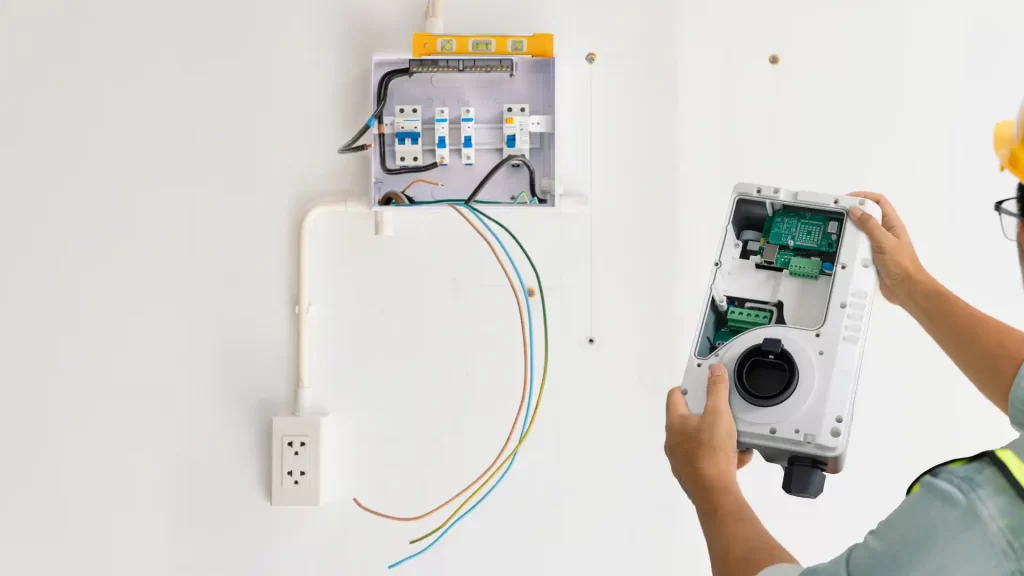 Professional Electrician fixing home breaker NWA