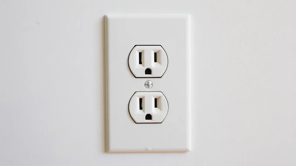 Two-prong outlet with plug adapter