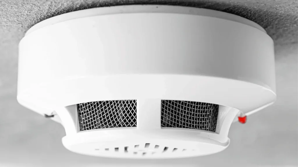 Residential smoke detector installed on a ceiling